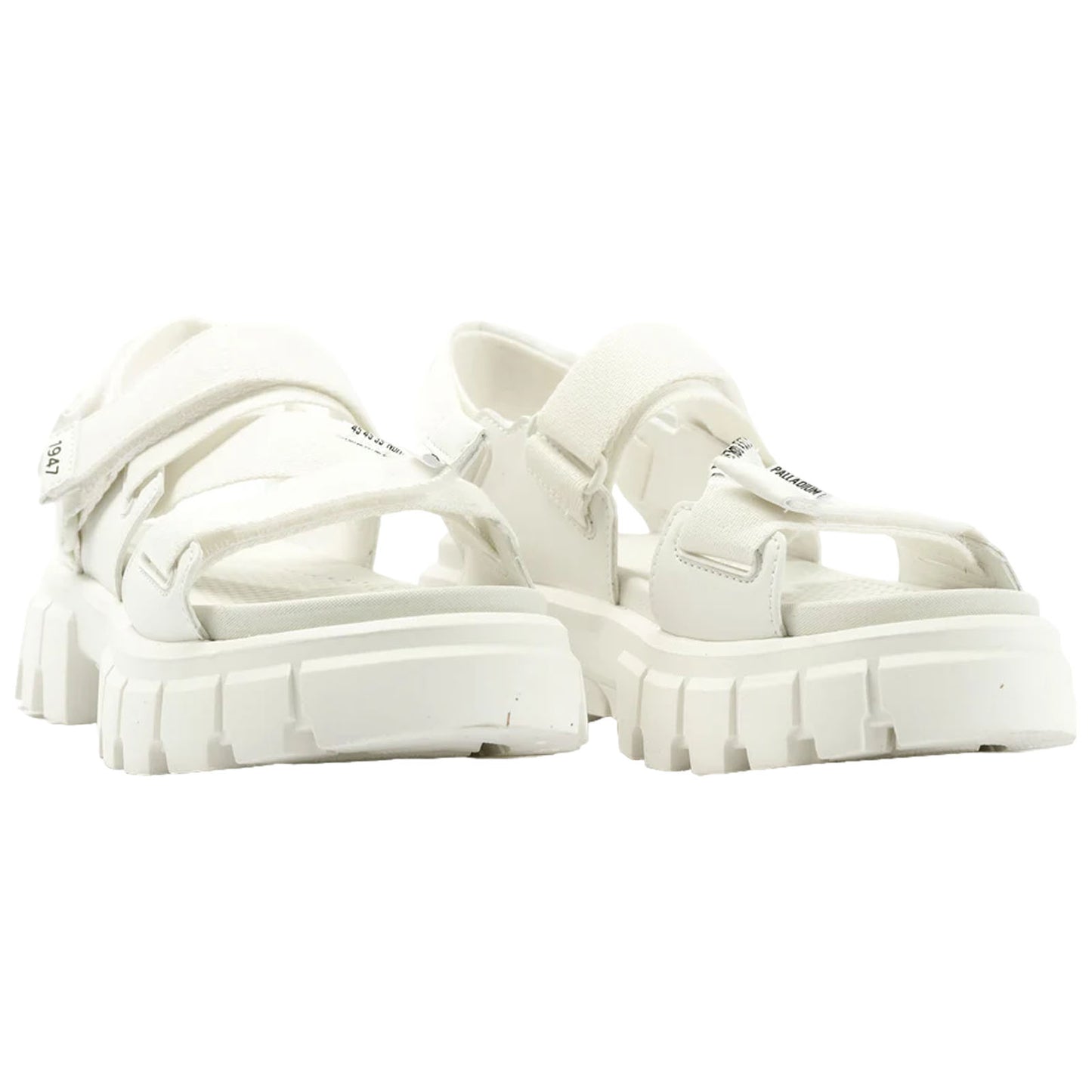 A pair of white sandals showcases a thick sole and multiple straps designed for secure fastening resting against a plain background suggesting a focus on footwear display.