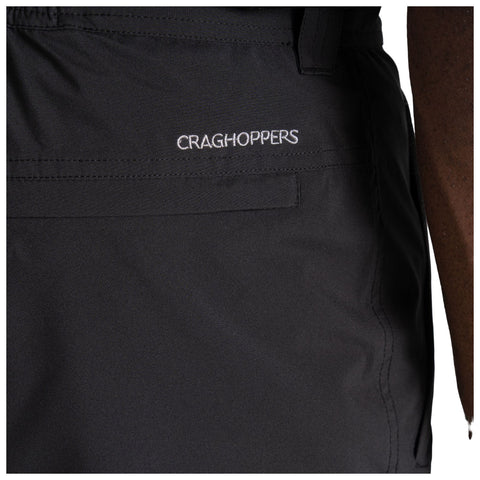 Black fabric shorts with an embroidered logo reading "CRAGHOPPERS" are shown. The shorts feature a side pocket and appear to be part of outdoor or casual attire.