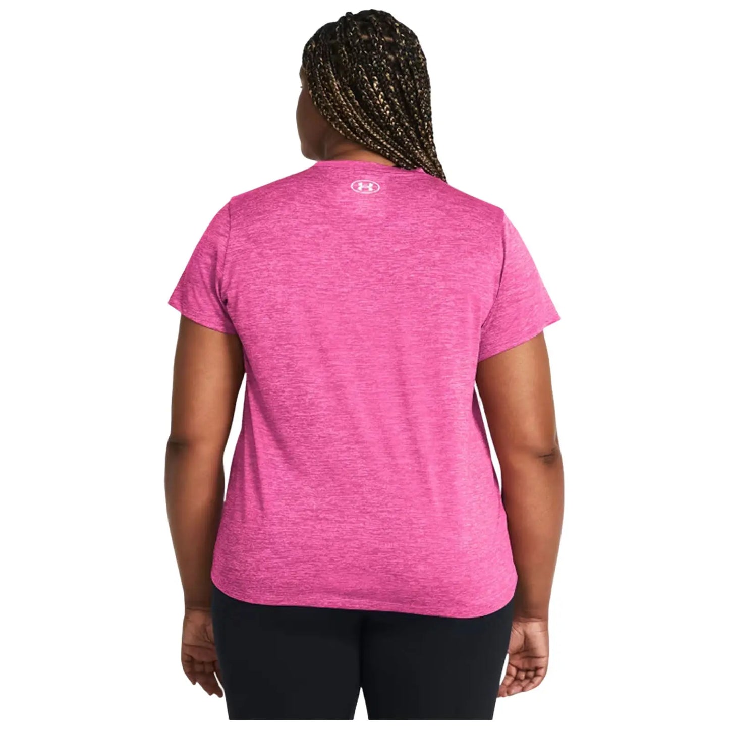 A person stands with their back facing the viewer wearing a pink athletic shirt and black pants in a neutral background, suggesting an active or casual setting.
