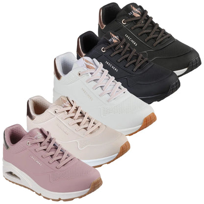 Four pairs of Skechers sneakers are displayed in a row each with a distinct color scheme including black white pale pink and light pink showcasing their sleek design and laced structure