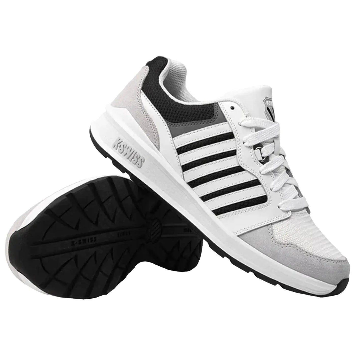 A pair of white and gray sneakers with black stripes is presented upright with one shoe slightly tilted. They are placed on a plain background, showcasing their design and sole pattern.