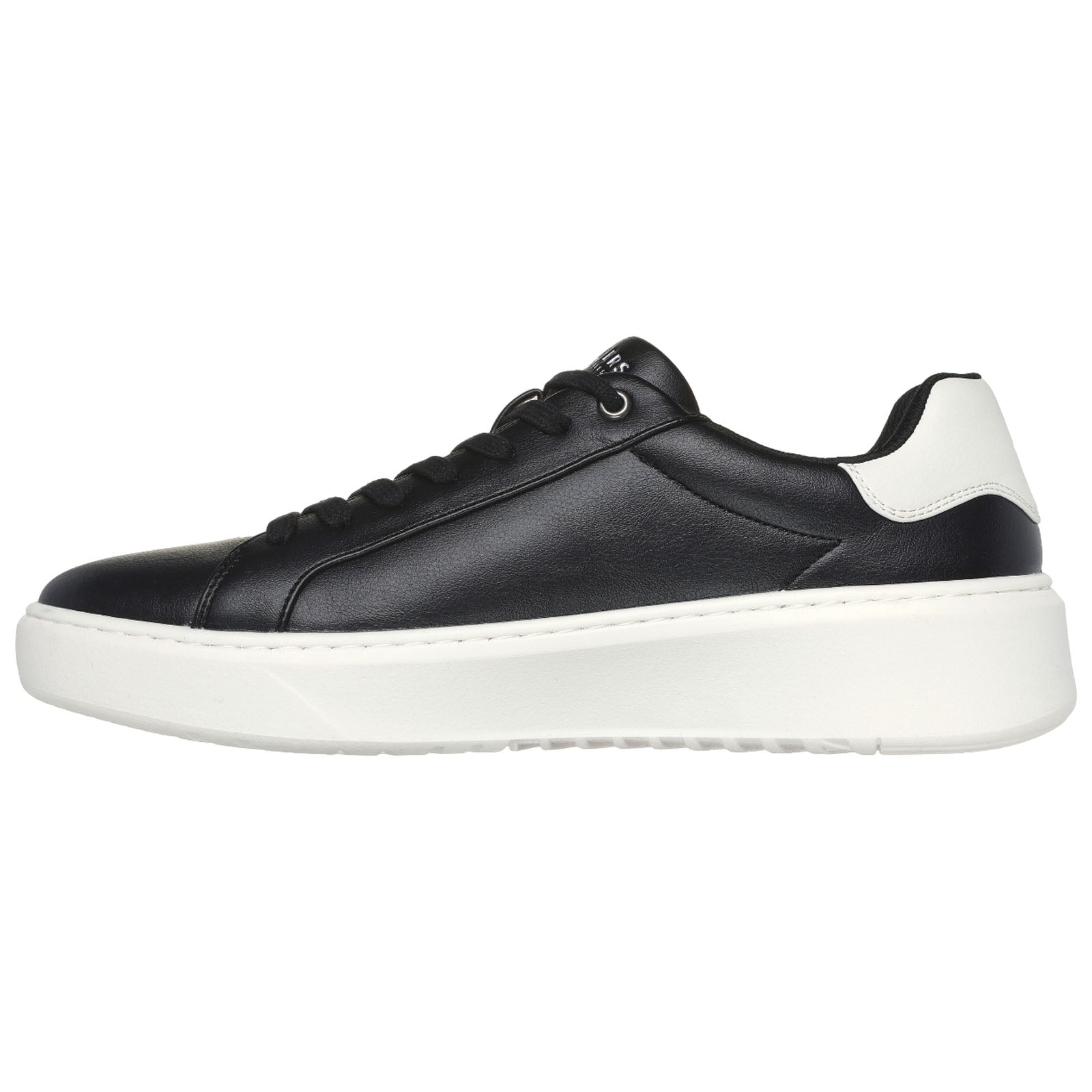 A black leather sneaker with a white sole features a sleek design and round laces situated on the left side, showcasing a modern sporty style against a plain white background.