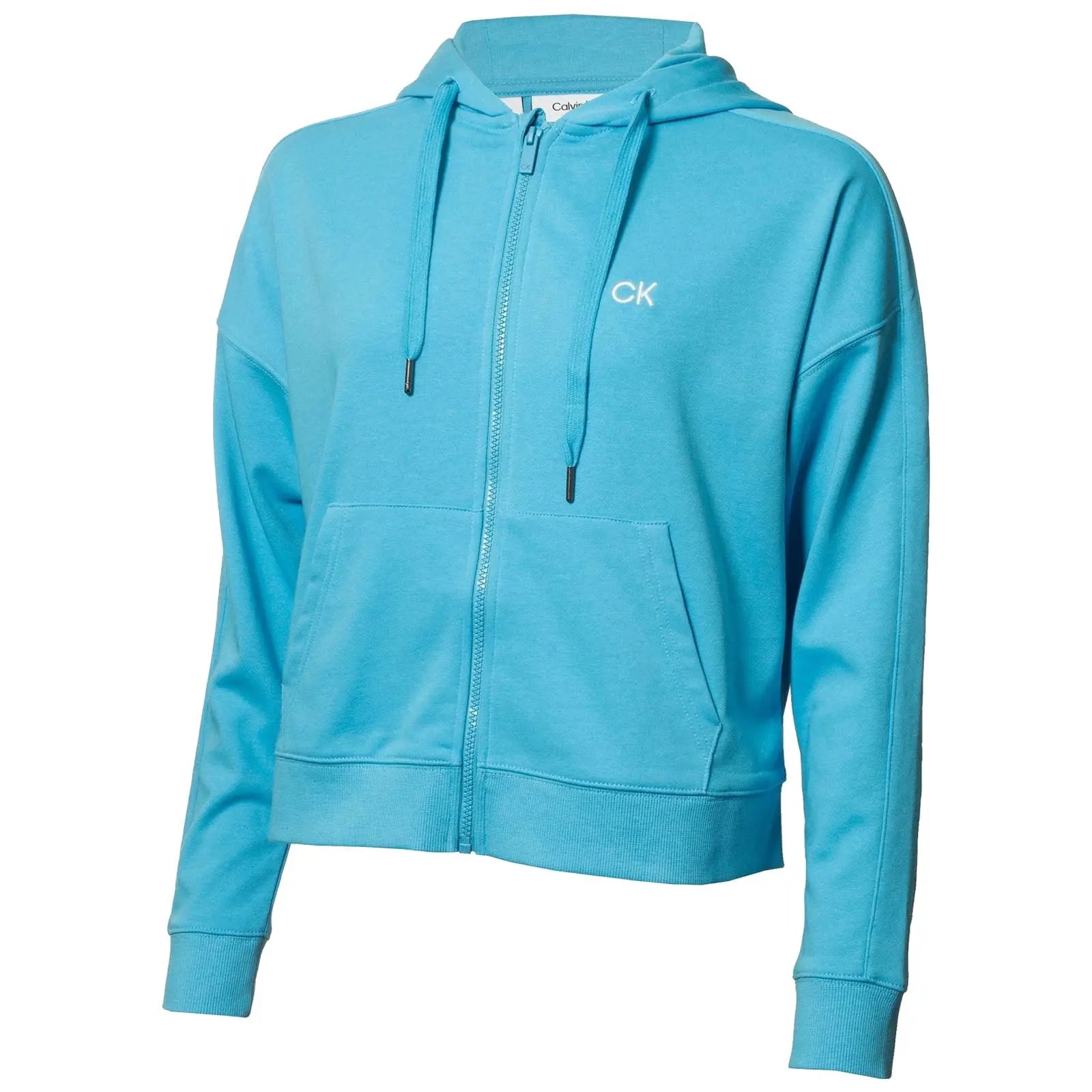 A light blue zip-up hoodie features a front pocket and drawstrings on the hood showcasing the Calvin Klein logo in white on the chest in a neutral background.