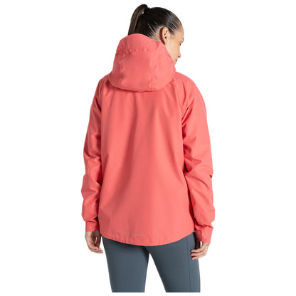 A person is wearing a bright coral jacket with a hood facing away from the viewer in a neutral background suggesting outdoor activity or casual wear.