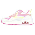 A sneaker with a white base features pink and yellow accents. It has a chunky sole with visible air cushioning and white laces, suitable for casual wear and light exercise.