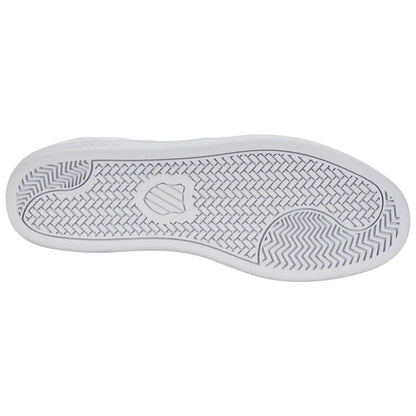 A white shoe sole with a textured pattern is displayed facing down on a neutral background emphasizing its design and grip features without any surrounding context or visible elements.