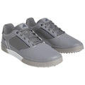 Gray sports shoes are displayed with laces and a sleek design featuring perforated sections emphasizing breathability ideal for active use in various environments