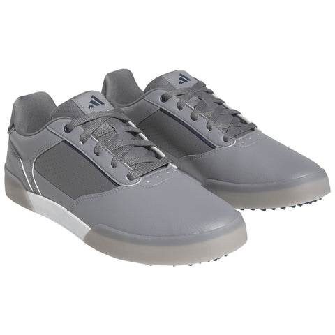 Gray sports shoes are displayed with laces and a sleek design featuring perforated sections emphasizing breathability ideal for active use in various environments