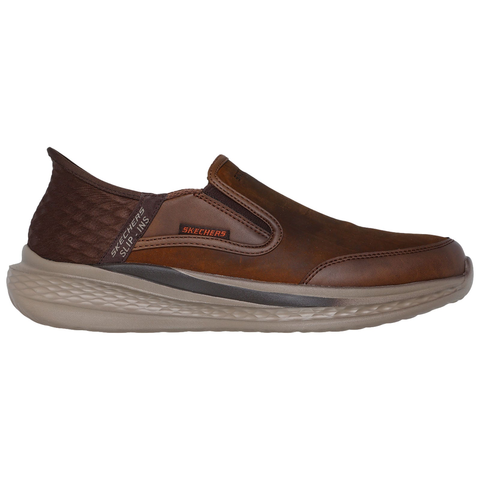 Brown slip-on shoes are positioned sideways displaying a smooth leather upper with elastic side panels and a cushioned sole designed for comfort in casual settings.