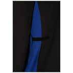 A clothing item features a black exterior with a blue panel hidden underneath it a small flap secured with a black elastic strap is visible on the side