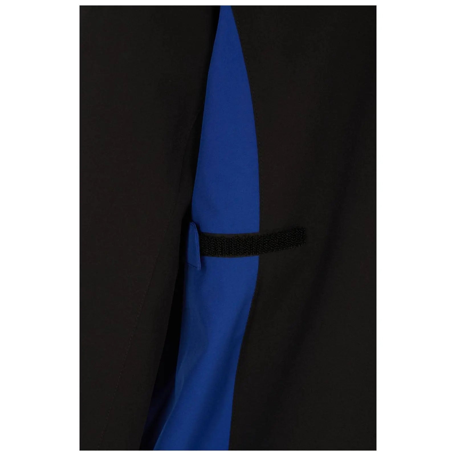 A clothing item features a black exterior with a blue panel hidden underneath it a small flap secured with a black elastic strap is visible on the side