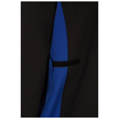 A clothing item features a black exterior with a blue panel hidden underneath it a small flap secured with a black elastic strap is visible on the side