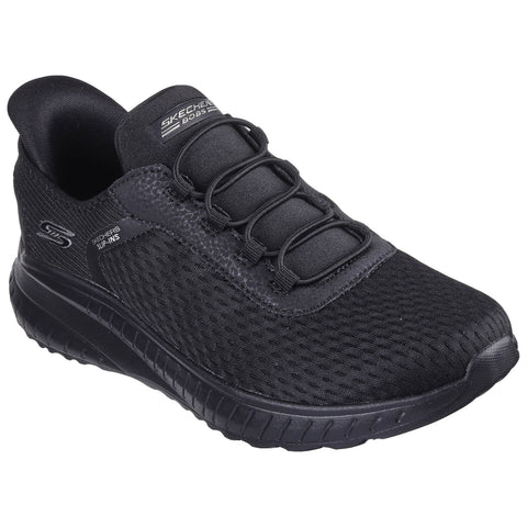 A black athletic shoe with a mesh upper and elastic laces is positioned prominently. It is designed for comfort and ease of wear in a casual or active setting.