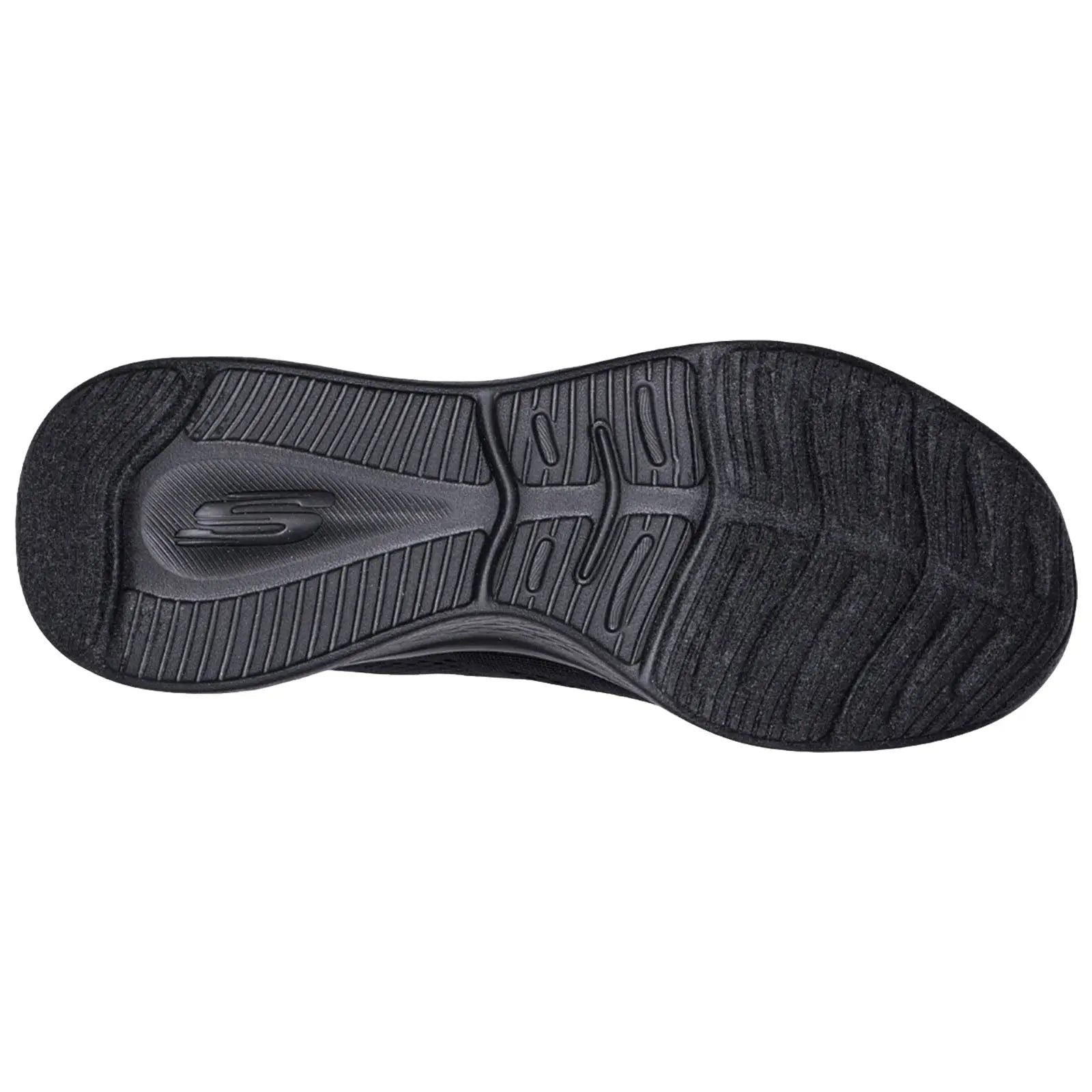 A shoe sole displays a textured black rubber surface designed for traction and comfort with a small logo visible in the center among various grooves and patterns.