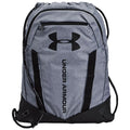A gray drawstring backpack with black accents features the Under Armour logo prominently displayed. It is designed for carrying personal items or sports equipment and appears sturdy and functional.