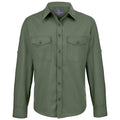 A long-sleeved green shirt with a button-down front features two chest pockets and buttoned cuffs designed for outdoor use in casual or practical settings.
