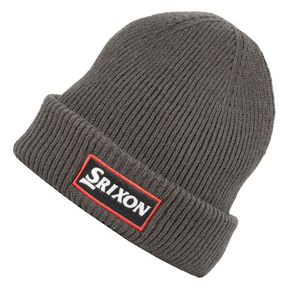 A gray knit beanie is positioned at an angle showcasing its ribbed texture and a prominent rectangular patch display featuring the word Srixon in black on a white background with red borders.