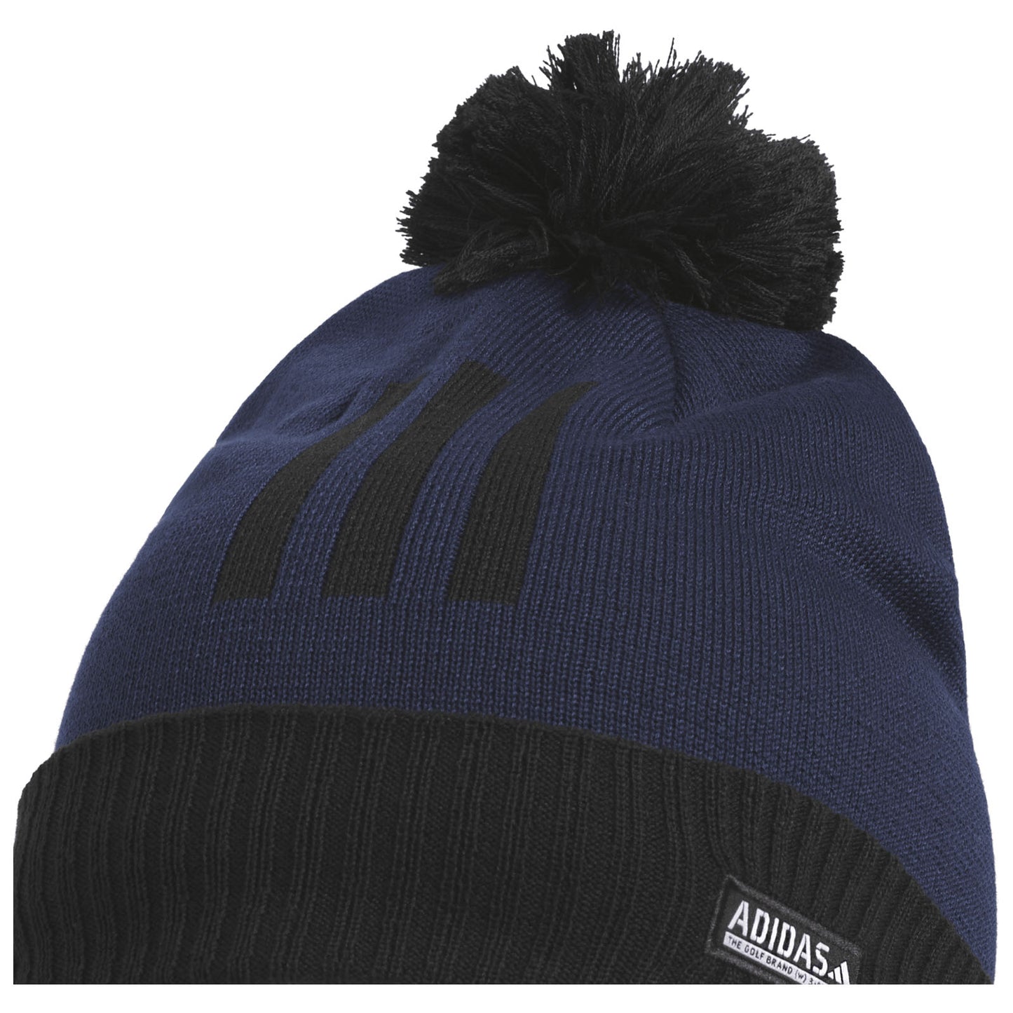 A navy blue knitted beanie with a black cuff features a pom-pom on top and three black stripes on the front, designed for warmth in cold weather contexts.