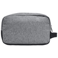 A gray fabric toiletry bag sits flat with a smooth surface and a black base showcasing a simple design suitable for travel or organization in a bathroom setting.