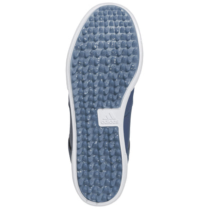 A navy sneaker sole is positioned flat against a neutral background showcasing its textured rubber surface and branding while indicating readiness for movement or activity.
