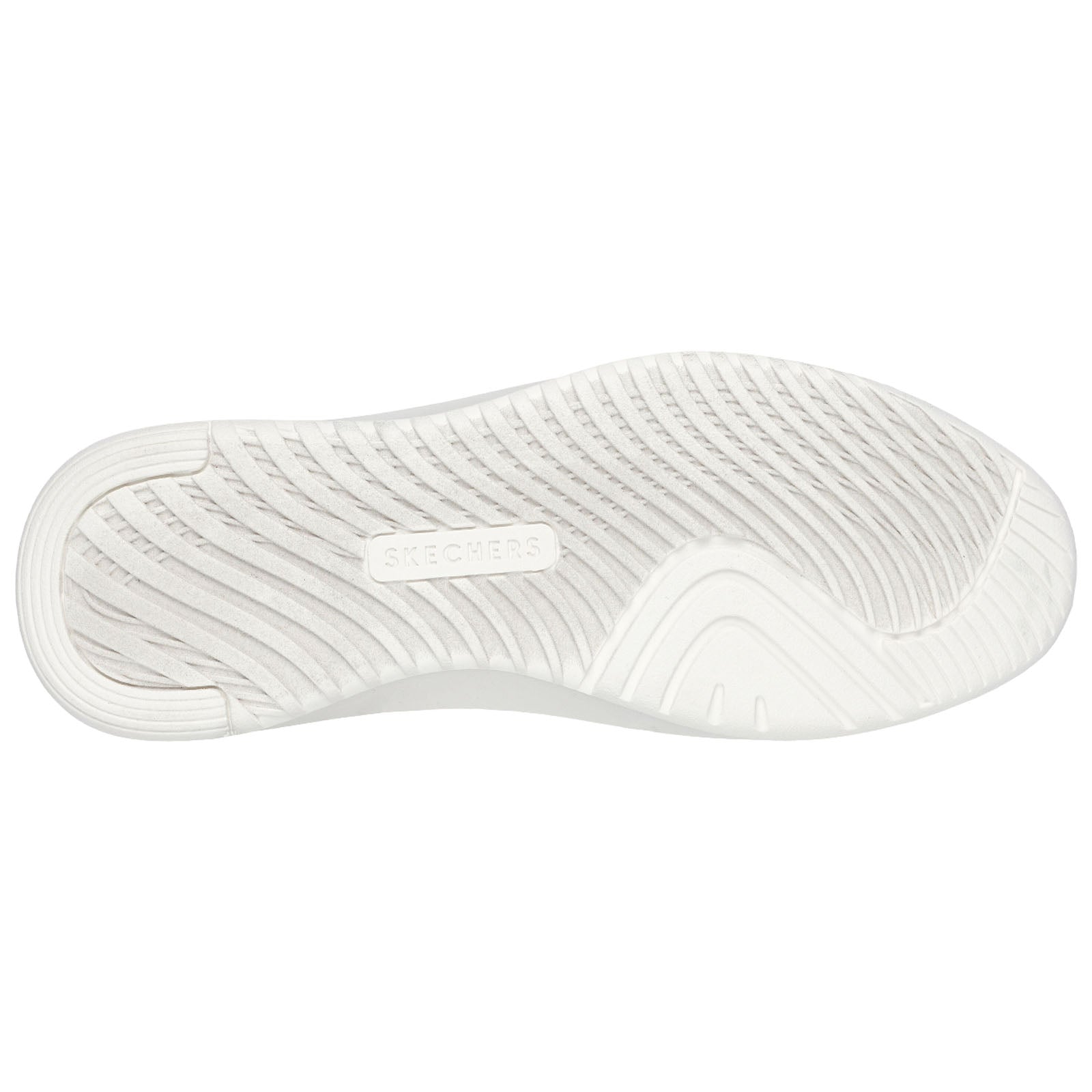 A white sneaker sole is shown resting on a flat surface displaying a textured pattern with a visible brand logo that reads SKECHERS in the center of the sole.