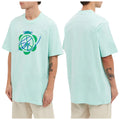 A light blue oversized t-shirt with a graphic design is being worn by a person standing in a neutral setting showcasing both the front and back views.