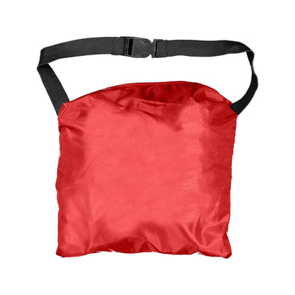 A red bag with a flat and smooth surface is being held by a black adjustable strap positioned at the top in a neutral surrounding environment without distractions.