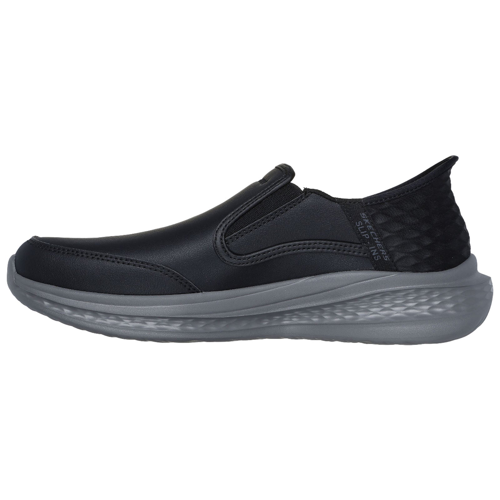 A black slip-on shoe features elastic side panels and a textured heel. It rests on a lightweight gray sole, suitable for casual wear and easy to put on.
