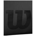 A black surface features a large stylized letter W prominently displayed in the center with a textured background enhancing its visibility