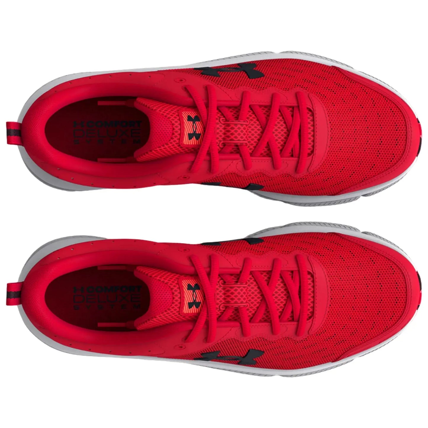 Bright red athletic shoes are positioned side by side showcasing the textured surface and lacing system. The interior features a logo alongside the text "COMFORT DELUXE SYSTEM."