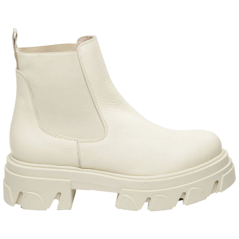 A white ankle boot with a textured surface features elastic side panels and a chunky sole. It is isolated against a plain background, showcasing its modern design.