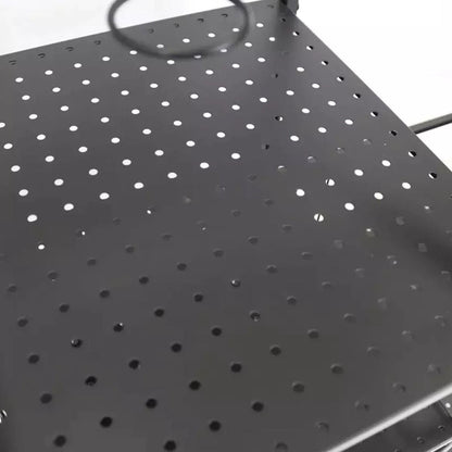 A metal shelf with numerous small holes is positioned flat. A circular wire is suspended above it, suggesting potential use or attachment. The background is plain and unobtrusive.