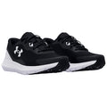 Two black athletic shoes are positioned top-down with white soles and laces. The shoes feature a mesh design and a prominent brand logo on the sides.