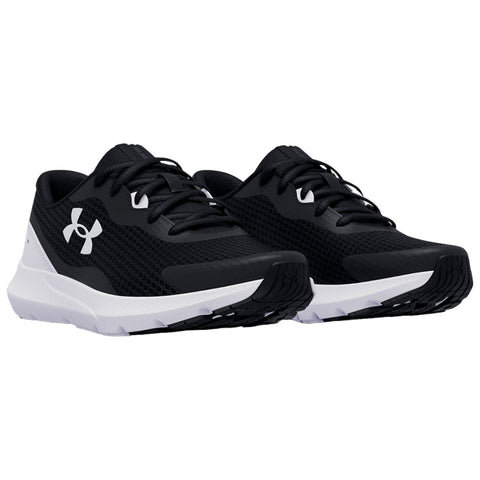 Two black athletic shoes are positioned top-down with white soles and laces. The shoes feature a mesh design and a prominent brand logo on the sides.