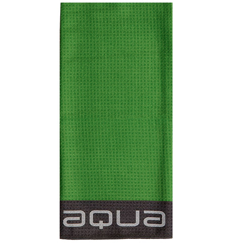 A bright green towel hangs vertically with a textured surface featuring black trim at the bottom containing the word aqua in a modern font