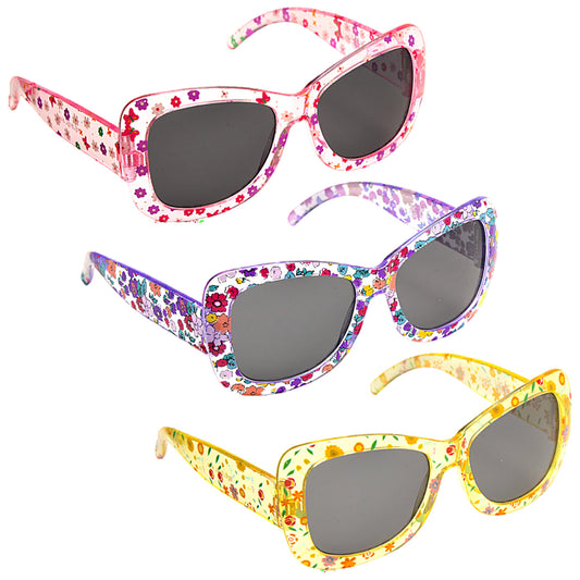 Three pairs of colorful flower-patterned sunglasses are displayed with dark lenses and angular frames resting together against a plain backdrop emphasizing their playful design and vibrant colors.