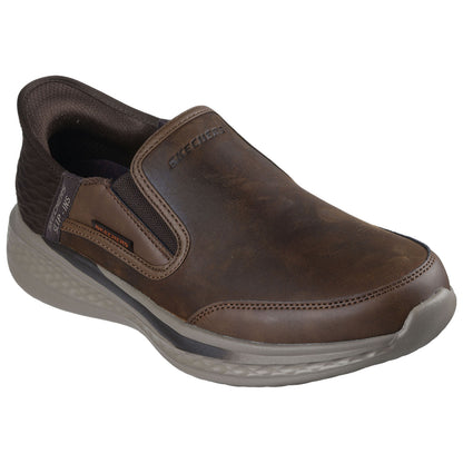 A brown slip-on shoe features a smooth leather upper with elastic side panels for easy wear and a cushioned sole providing comfort in casual settings.