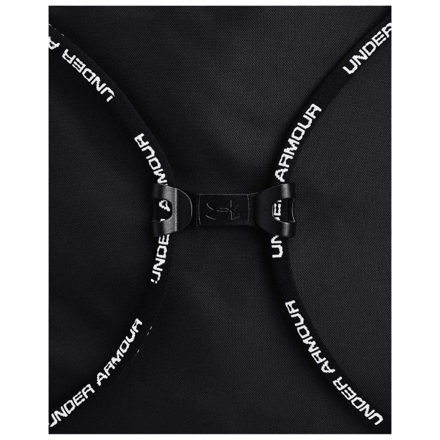 A black backpack features a clasp with adjustable straps displaying "UNDER ARMOUR" text the bag is positioned flat showing its design and closure mechanism.