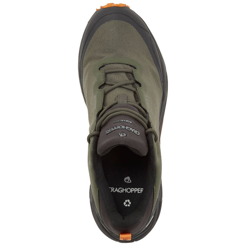 A green hiking shoe is positioned with its top view visible highlighting the laces and logo while the textured surface suggests durability suitable for outdoor activities.