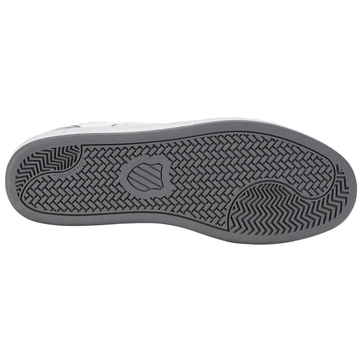 A shoe's sole is displayed with a textured design underneath showcasing grooves and patterns for traction emphasizing its functional purpose on different surfaces.