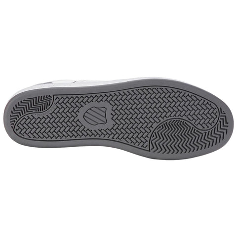 A shoe's sole is displayed with a textured design underneath showcasing grooves and patterns for traction emphasizing its functional purpose on different surfaces.