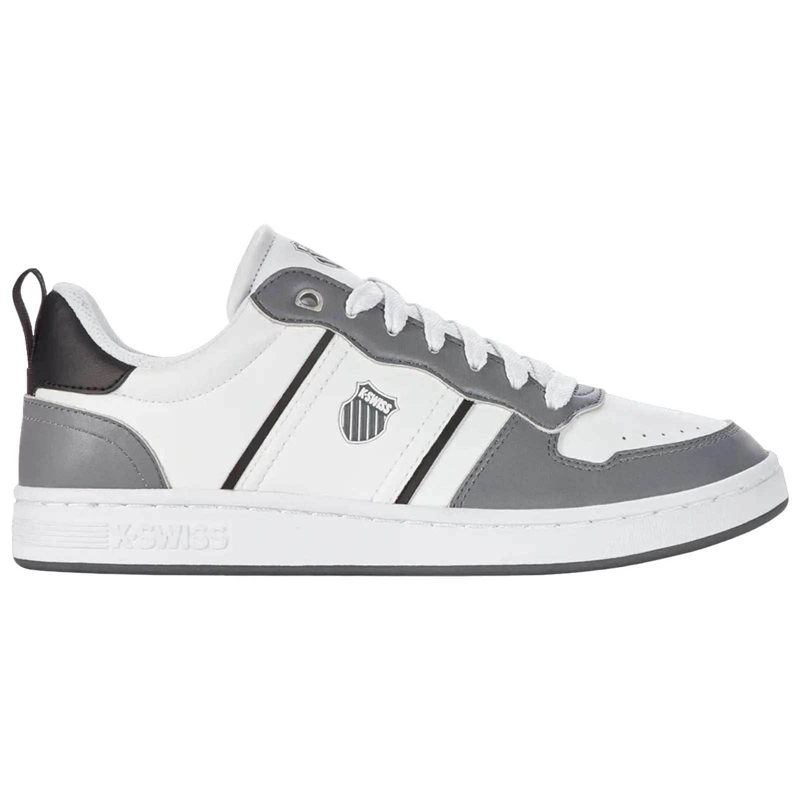 A gray and white sneaker is positioned on a flat surface with a sleek design featuring a logo on the side and laces threaded through eyelets creating a casual sports aesthetic.