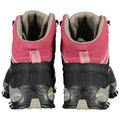 A pair of outdoor boots stands upright with a pink and black design featuring a high ankle and a textured sole suitable for rough terrain in a neutral background.