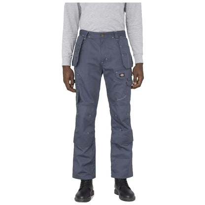 Dark gray cargo pants are being worn by a person with black boots standing in front of a neutral background. The pants feature multiple pockets and visible stitching details.
