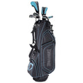 A black and blue golf bag stands upright holding several golf clubs at the top with zippers and straps for carrying set against a plain background.