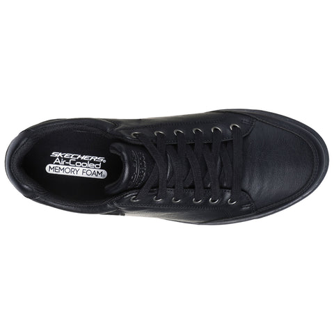 Black leather sneaker featuring laces and a padded collar resting flat. Inside the shoe, a label reads SKECHERS Air-Cooled MEMORY FOAM, indicating a focus on comfort and cushioning.