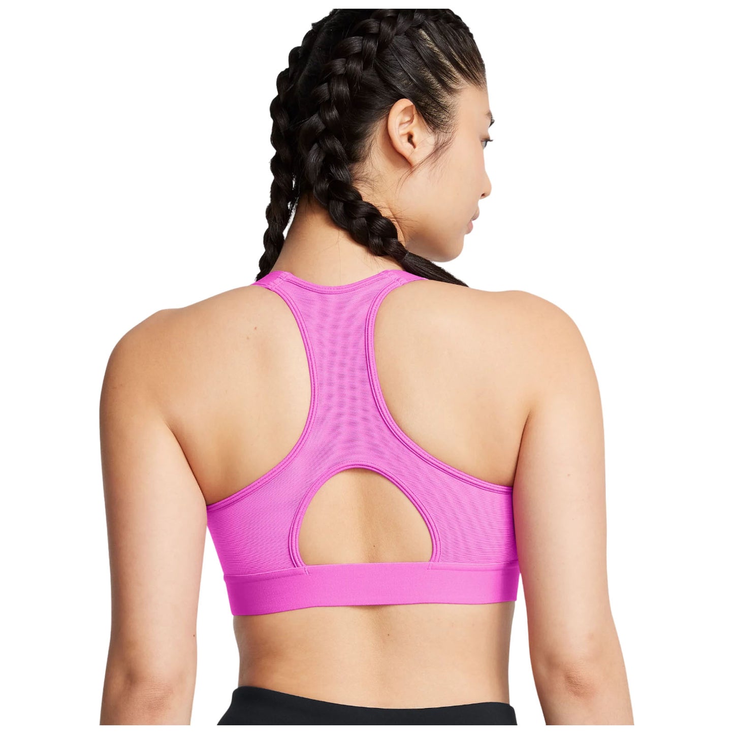 A person with braided hair is wearing a pink athletic tank top featuring a cutout design on the back while facing away from the viewer in a plain background.