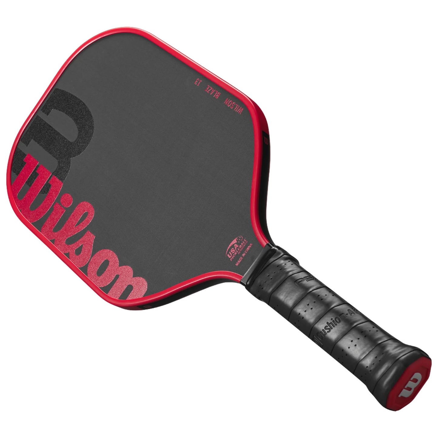 A red and black paddle with a textured surface lies flat showing the grip and branding details The paddle is designed for racket sports like pickleball or tennis