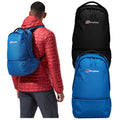 A person in a red puffer jacket carries a blue backpack while two additional backpacks hang beside them one in blue and one in black each with the logo berghaus displayed.