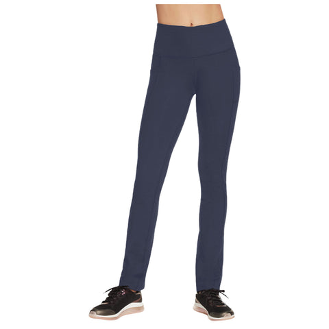 Navy athletic leggings are paired with black sneakers the leggings feature a high waistband and side pockets they are designed for active wear in a fitness or casual setting